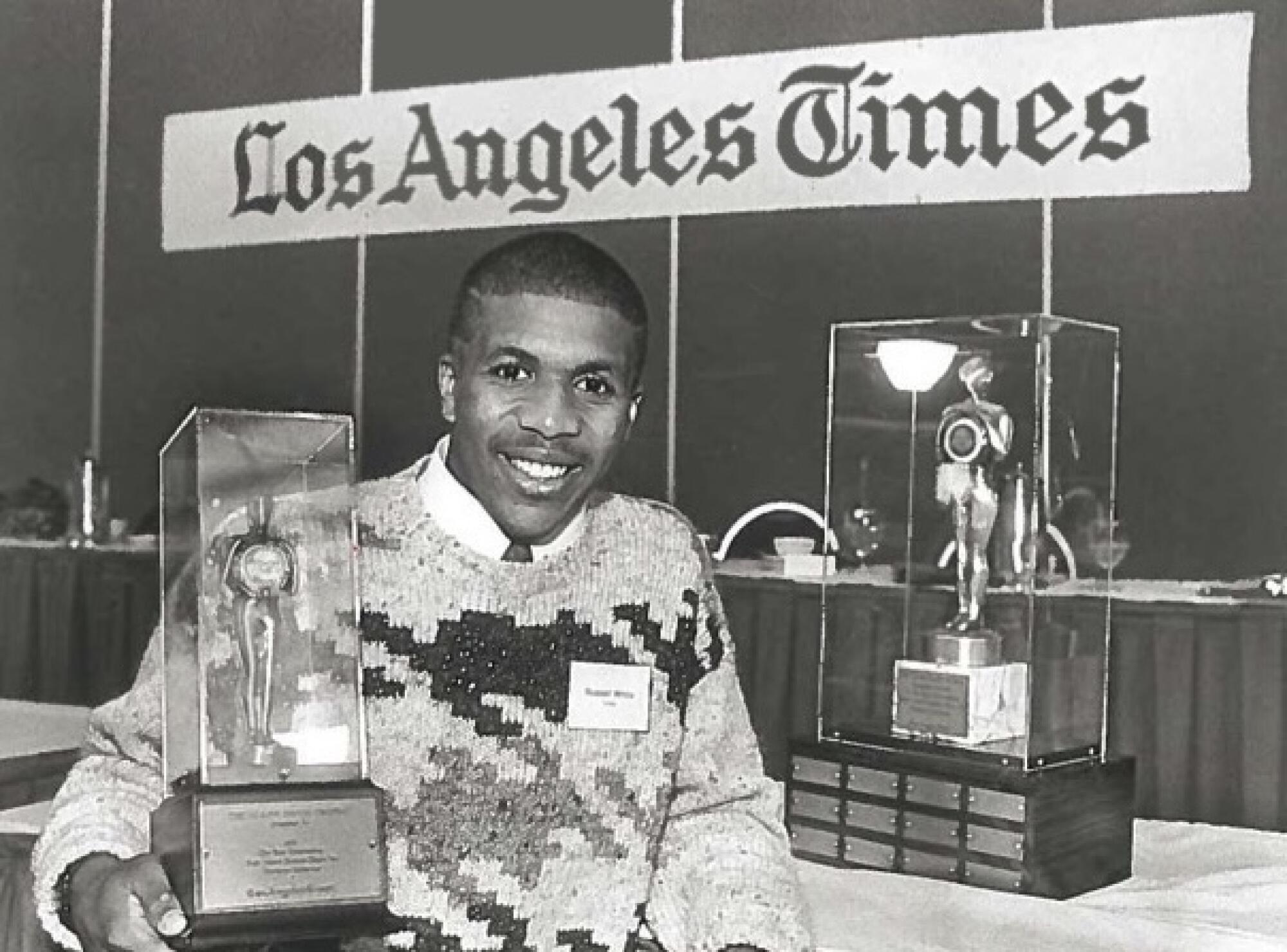 Crespi running back Russell White holding the Glenn Davis trophy in 1987.