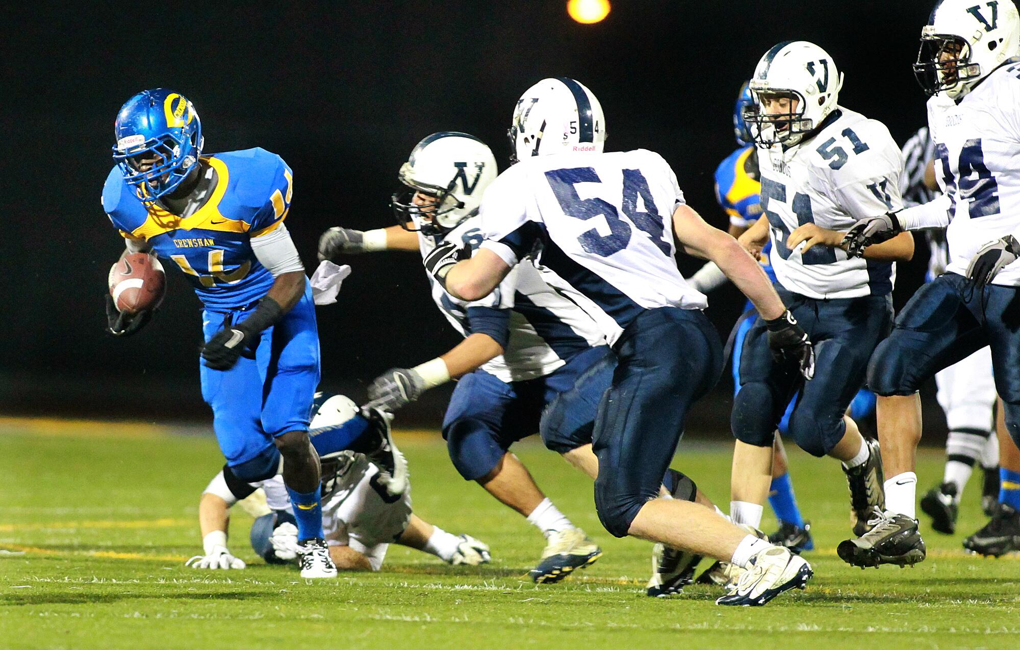 Crenshaw's De Anthony Thomas runs past the Venice defense during a playoff game in December 2010.