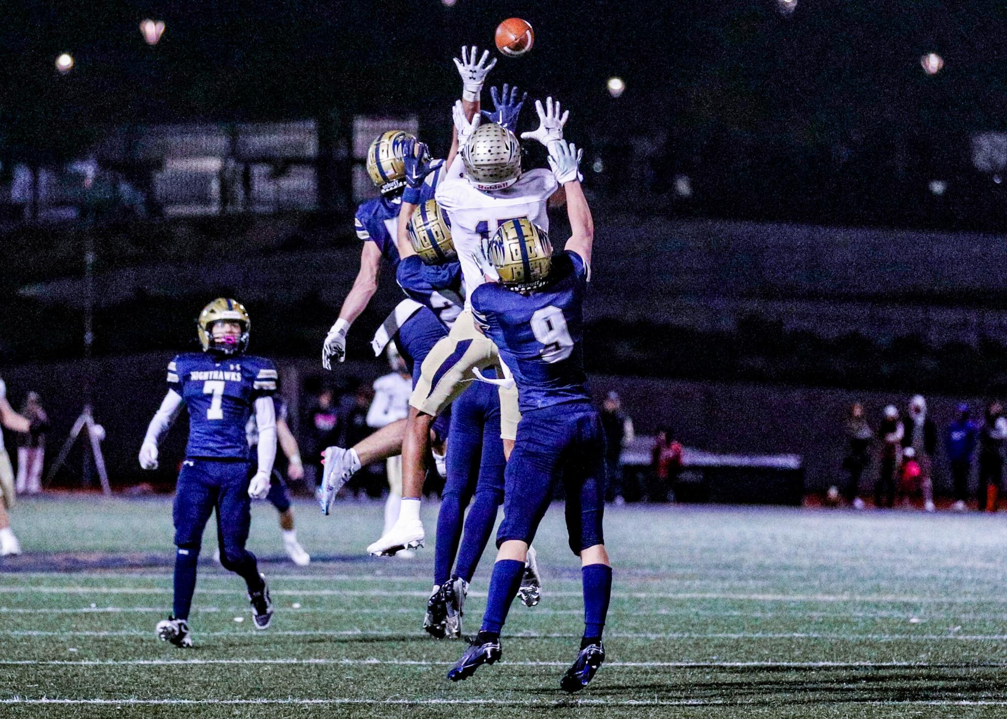 Birmingham's Peyton Waters, center, tries to outjump Del Norte defenders for a Hail Mary pass in the final seconds Friday.