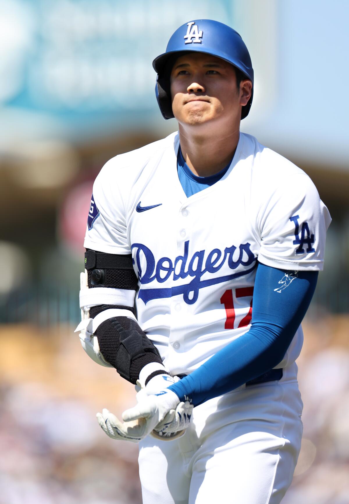 Shohei Ohtani holds his wrist after getting hit by a pitch in the eighth inning against the Rays on Sunday.