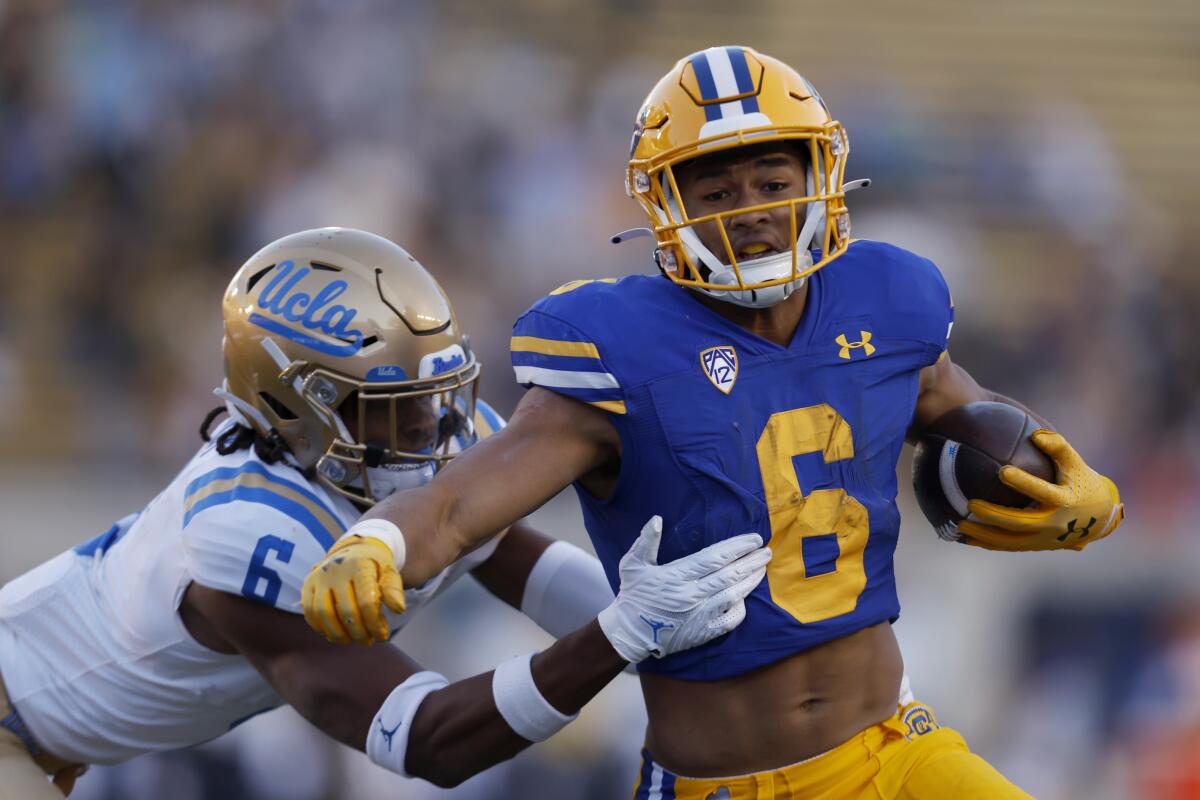 California running back Jaydn Ott (6) runs for a touchdown against UCLA 