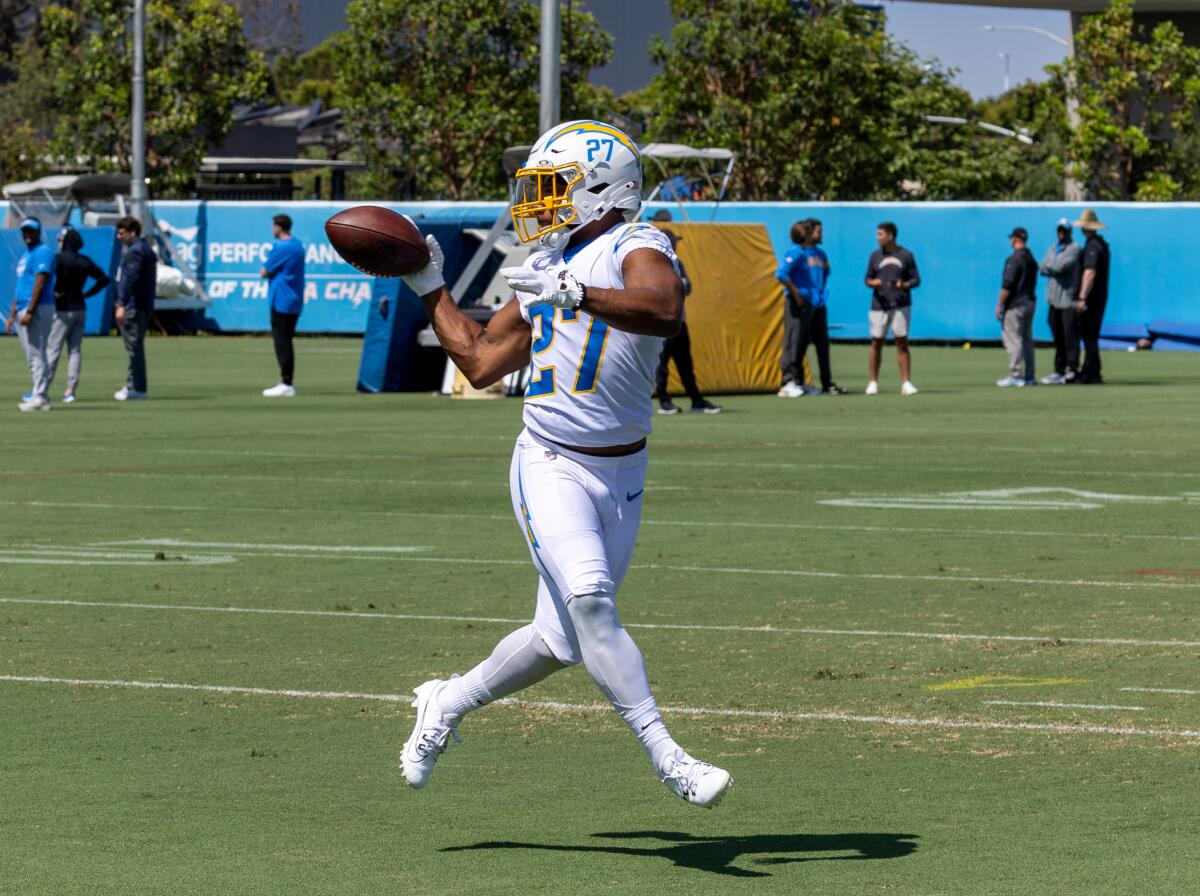  Chargers running back J.K.. Dobbins catches a pass during practice.