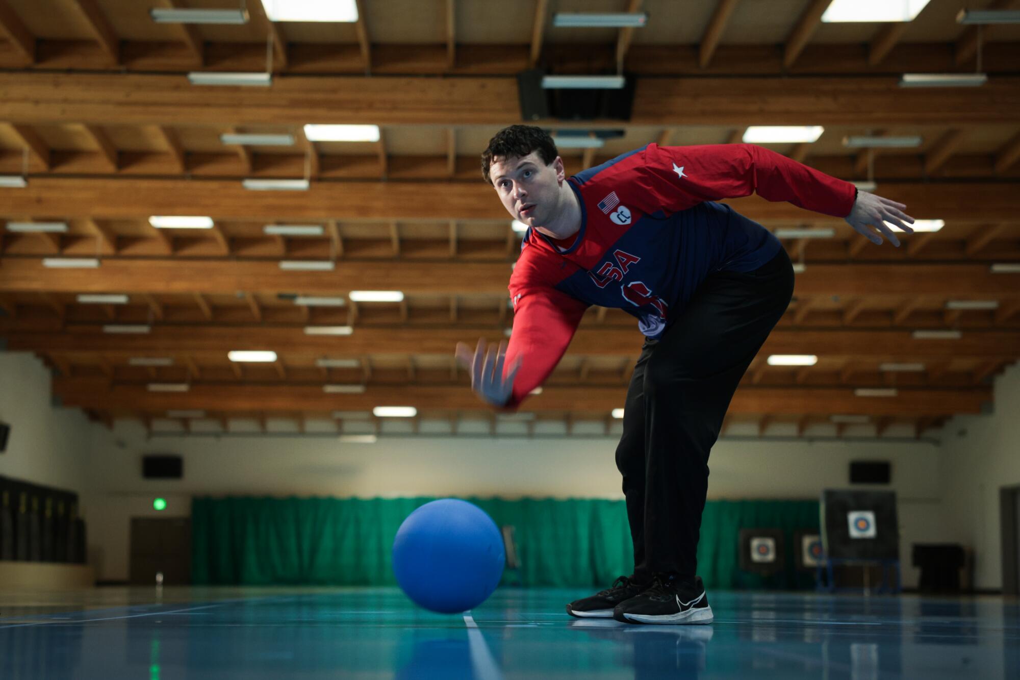 Goalball parathlete Calahan Young throwing a ball