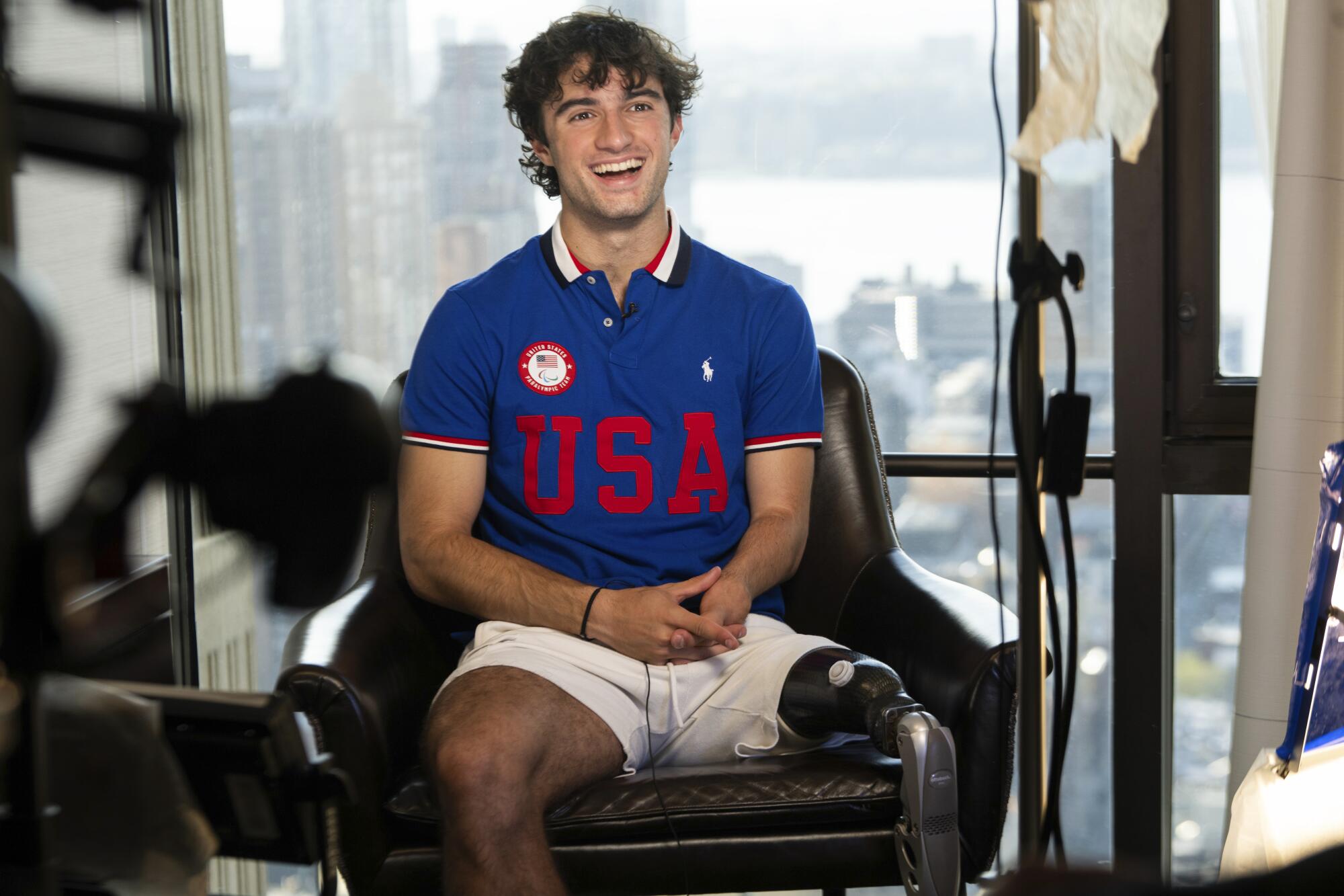 Ezra Frech smiles in a USA shirt.