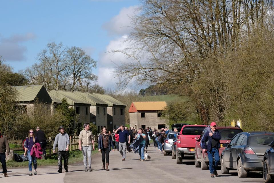 Visitors walk through the eerie uninhabited Imber