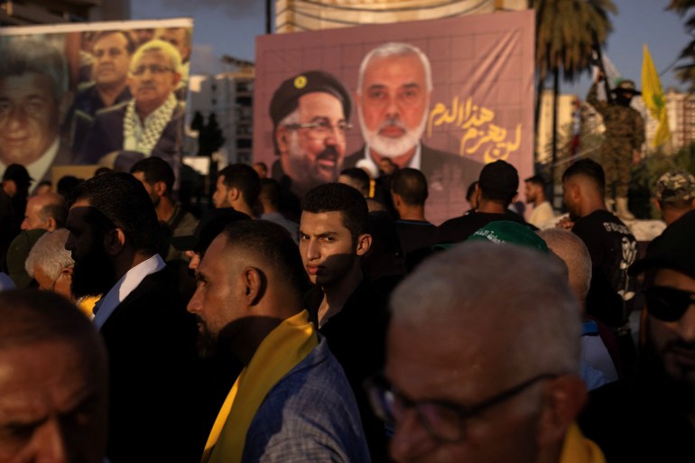 Supporters of Hamas and Hezbollah take part in a protest condemning the killing of Hamas leader Ismail Haniyeh and Hezbollah top commander Fuad Shukr, in Sidon, Lebanon.