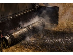 A roller on the back of a remote-controlled BurnBot RX1 prototype snuffs out scorched earth during a prescribed burn operation in Paicines, California, US, on Saturday, Aug. 12, 2023. Burnbot, a robotics startup working on fuel management to mitigate wildfire risk, created the BurnBot RX1 to help make containment lines for prescribed burns. Photographer: Philip Pacheco/Bloomberg