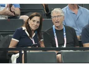 Bill Gates and Paula Hurd during the artistic gymnastics women's team final on July 30.