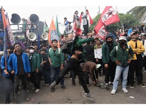 Protesters outside the parliament in Jakarta, on Aug. 22. Photographer: Dimas Ardian/Bloomberg