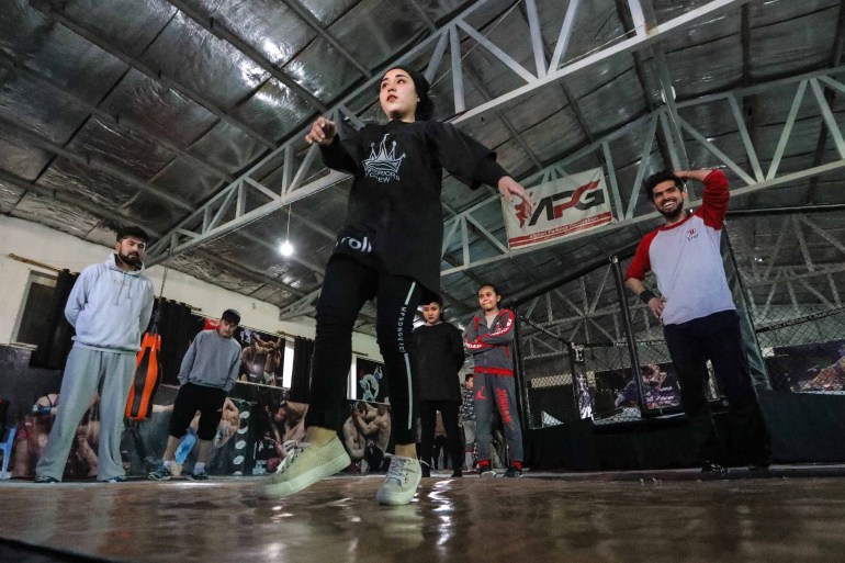 epa09005705 Manizha Talash (C), a 18-year-old Afghan girl, practices break dancing during a training session in Kabul, Afghanistan, 05 February 2021 (issued 12 February 2021). A group of young Afghan boys and girls founded a Breaking (breakdance) club a year ago in Kabul, braving all social and security challenges and threats to professionally promote breakdancing in Afghanistan. The club has 40 members, of whom six are female, and gather three times a week to practice the acrobatic moves, including headspins, that are hallmarks of breaking dancing. Based on the Afghan social norms and conservative culture, girls are strongly prohibited to do sport with men, but some girls dared to join the Breaking club. Breaking also called breakdance, B-Boying, or B-Girling is a style of street dance, invented in the 1970s in the United States, was among four sports, along with skateboarding, sports climbing, and surfing, that the International Olympic Committee agreed recently to add to the Paris Games in 2024, in an effort to attract a younger, more urban audience. EPA-EFE/HEDAYATULLAH AMID