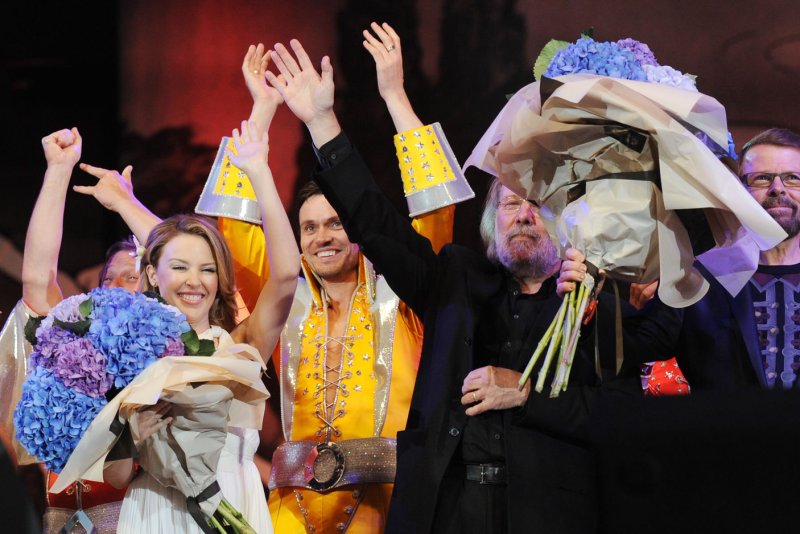 Australian singer Kylie Minogue and Swedish composers Benny Andersson and Bjorn Ulvaeus from ABBA at "Thank You For The Music: A Celebration Of The Music Of ABBA" in Hyde Park in London on September 13, 2009. File Photo by Rune Hellestad/UPI