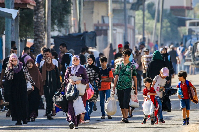 Displaced people flee from the eastern parts of Deir el-Balah to the city centre in the central Gaza Strip on June 8, 2024 amid the ongoing conflict in the Palestinian territory between Israel and Hamas. (Photo by Eyad BABA / AFP)