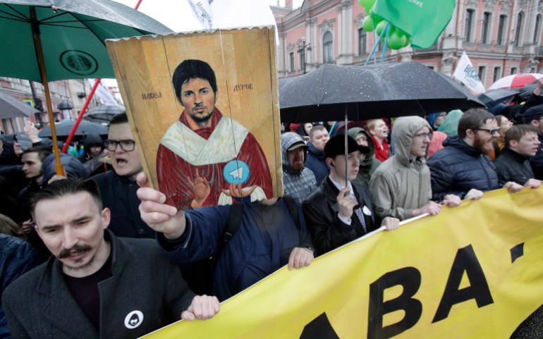 Protesters hold a portrait of messaging app Telegram co-founder Pavel Durov designed as an icon, protesting against the blocking of the app