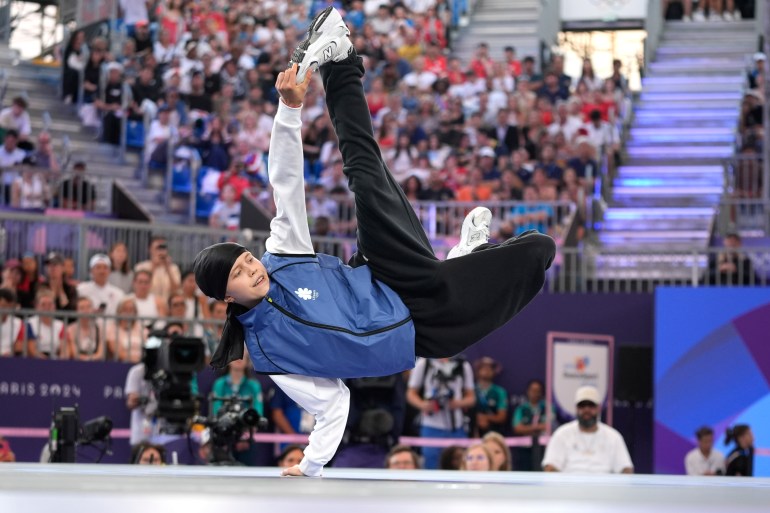 Lithuania's Dominika Banevic, known as B-Girl Nicka, competes during the B-Girls quarterfinals at the breaking competition at La Concorde Urban Park at the 2024 Summer Olympics, Friday, Aug. 9, 2024, in Paris, France. (AP Photo/Frank Franklin)