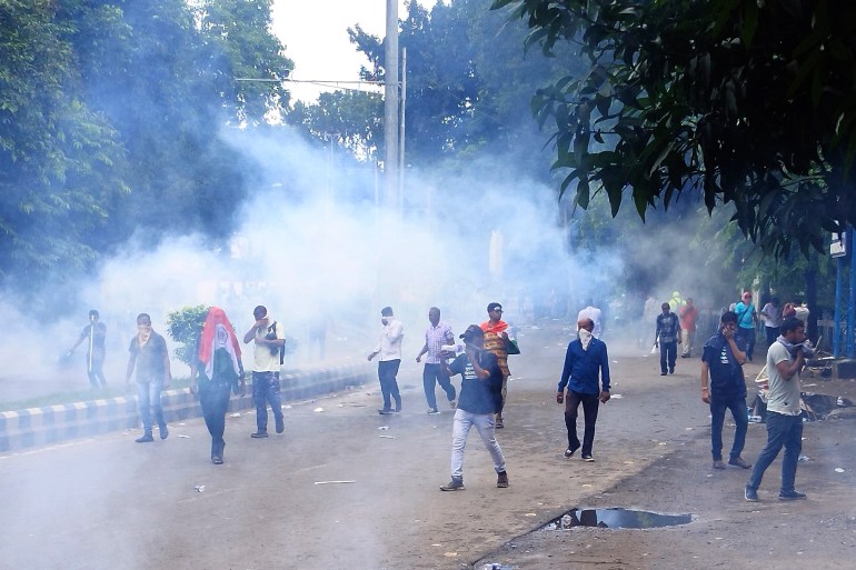 Police fire tear gas shells to disperse people protesting against the rape and murder of a resident doctor at a government hospital earlier this month, in Kolkata, India,