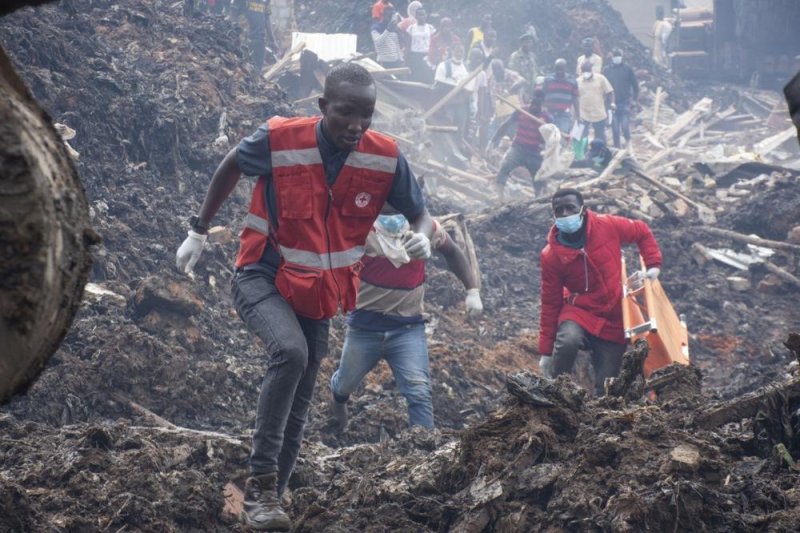 Rescue workers found at least 14 people still alive as recovery efforts continue Saturday at the Kiteezi landfill north of Kampala, Uganda. Photo by Isaac Kasamani/EPA-EFE