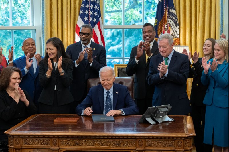 President Joe Biden is joined by civil rights leaders, community members, and elected officials to sign a proclamation to designate the Springfield 1908 Race Riot National Monument in the Oval Office in Washington, D.C., on Friday. Photo by Annabelle Gordon/UPI