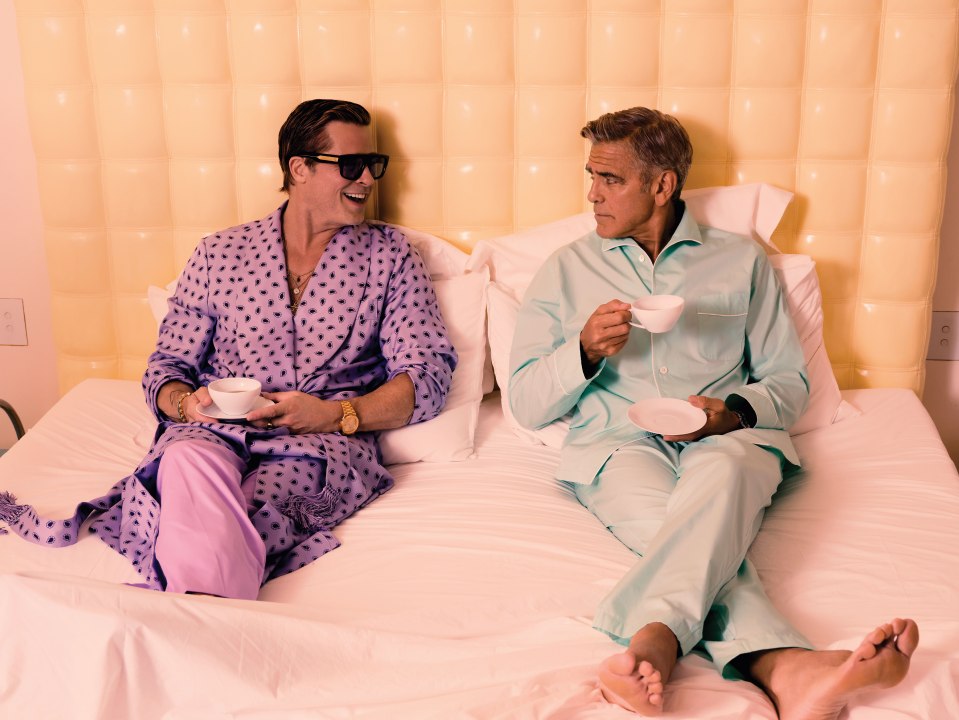 Actors Brad Pitt and George Clooney do their best Morecambe and Wise impression in bed