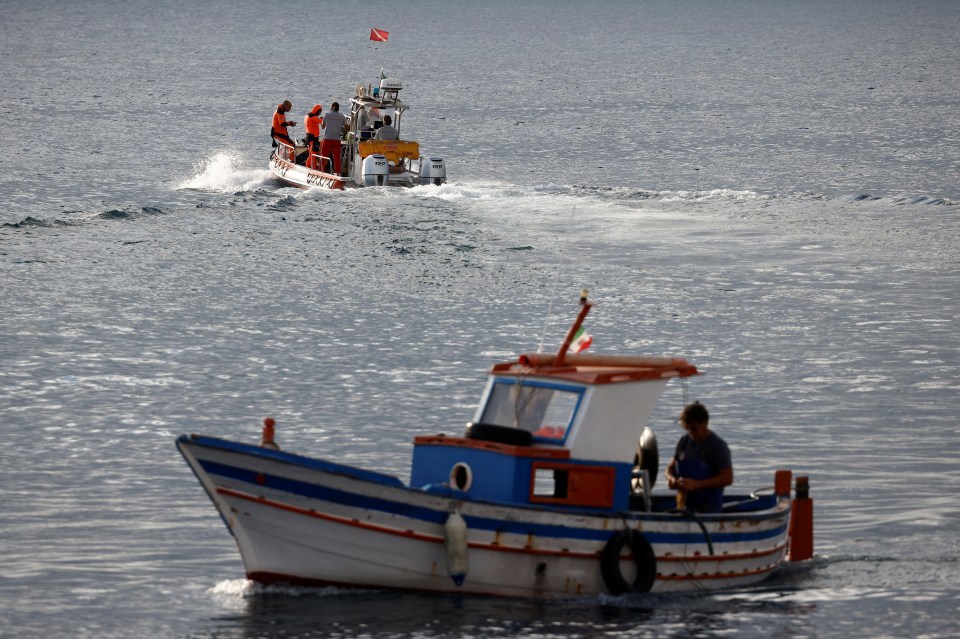 Italian rescue divers resume their search off the coast of Porticello, Sicily, on Thursday morning