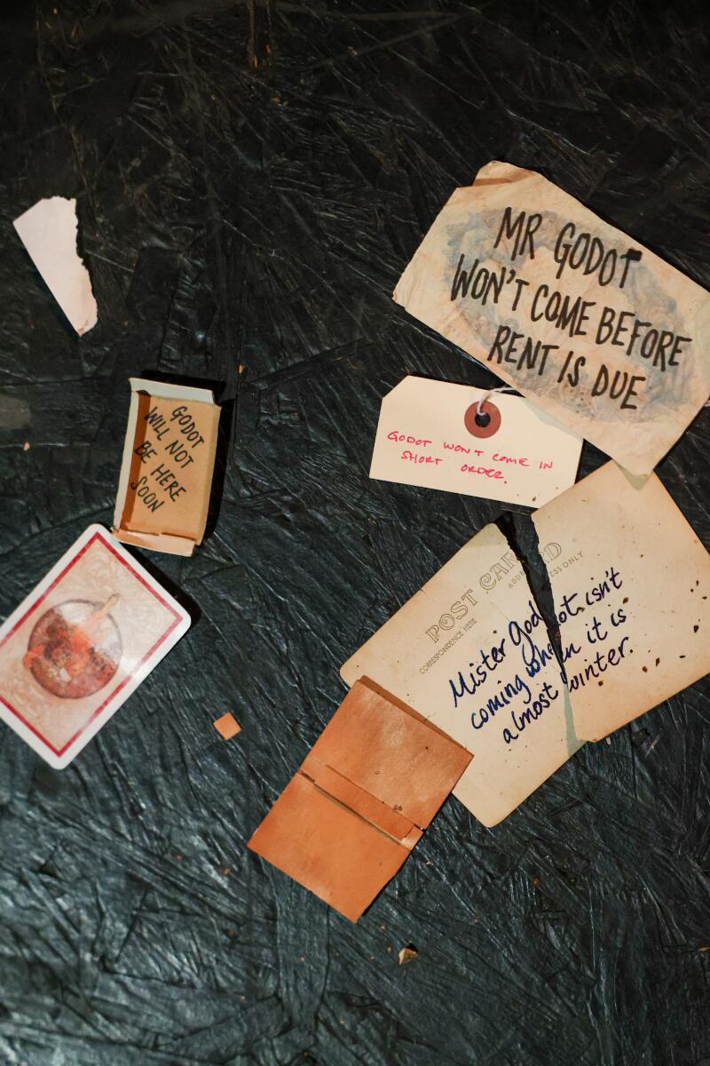 Cards and letters lay on the ground for audience members to discover the next clue.