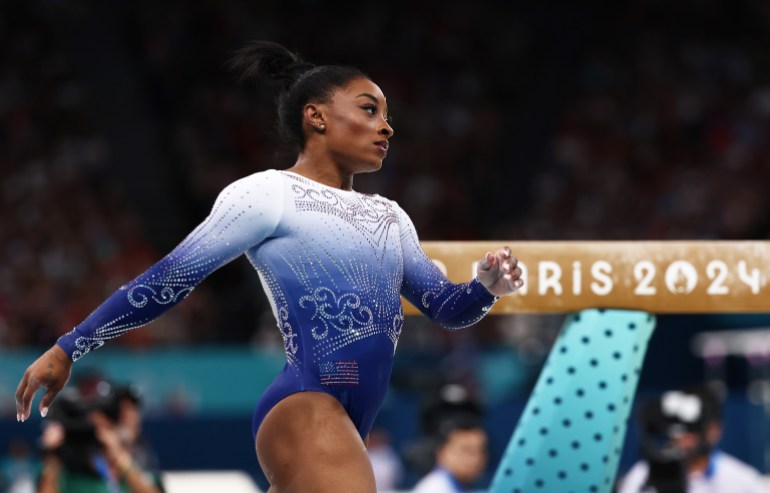 Simone Biles walking after beam routine.