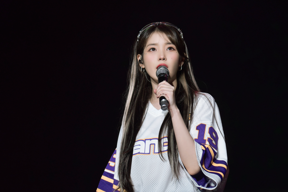 IU performs onstage.