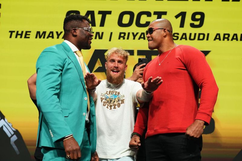 Francis Ngannou in between Jake Paul and Renan Ferreira