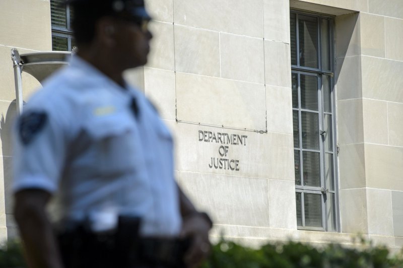 A Chinese American was convicted by a New York jury Tuesday on charges stemming from his nearly two decades spying on dissidents for China. File Photo by Bonnie Cash/UPI