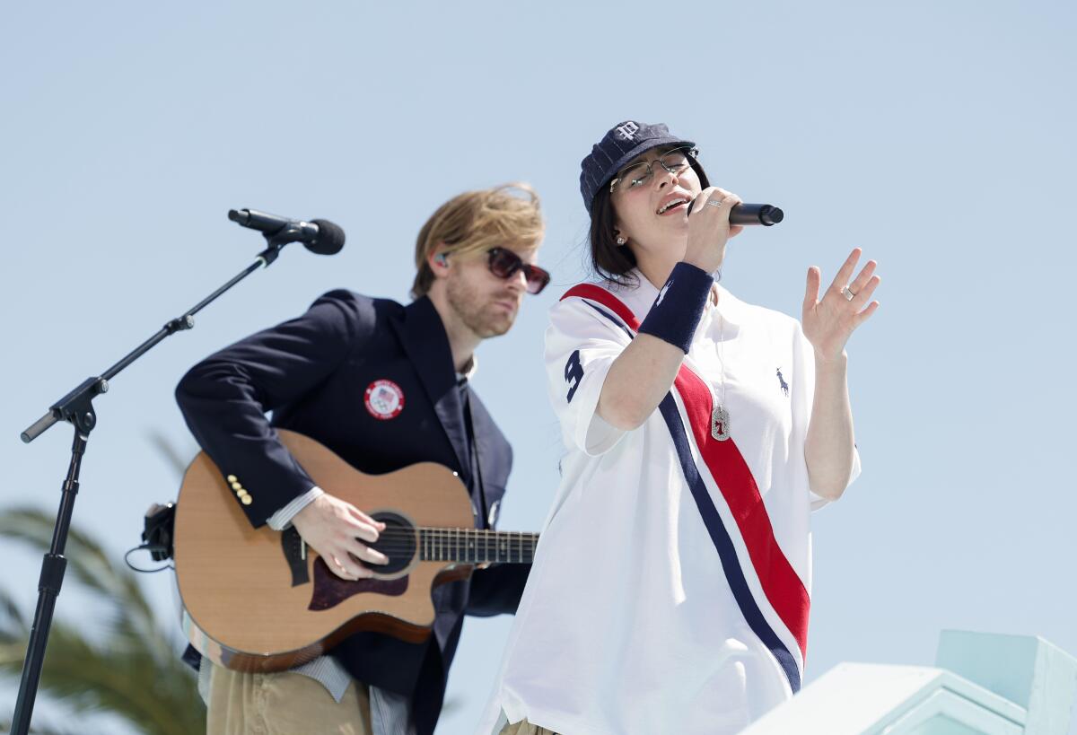 Finneas and Billie Eilish perform in Long Beach for the handover celebration of the Olympic Games.