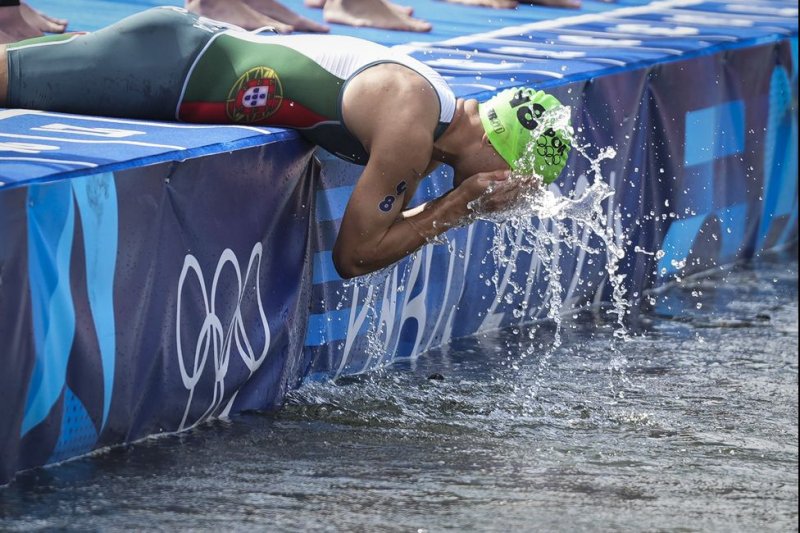 Vasco Vilaca of Team Portugal splashes water from the Seine river in his face before the start of the men's triathlon during the 2024 Paris Summer Olympic Games in Paris, France, Wednesday, July 31. Photo by Paul Hanna/UPI