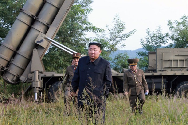 North Korean leader Kim Jong Un (C) supervises the test-firing of a "super-large multiple rocket launcher" weapon in 2019. On Thursday, the U.S. Justice Department announced that a Tennessee man has been arrested for allegedly helping North Korea raise money to buy illicit weapons, including weapons of mass destruction. File Photo by KCNA/UPI