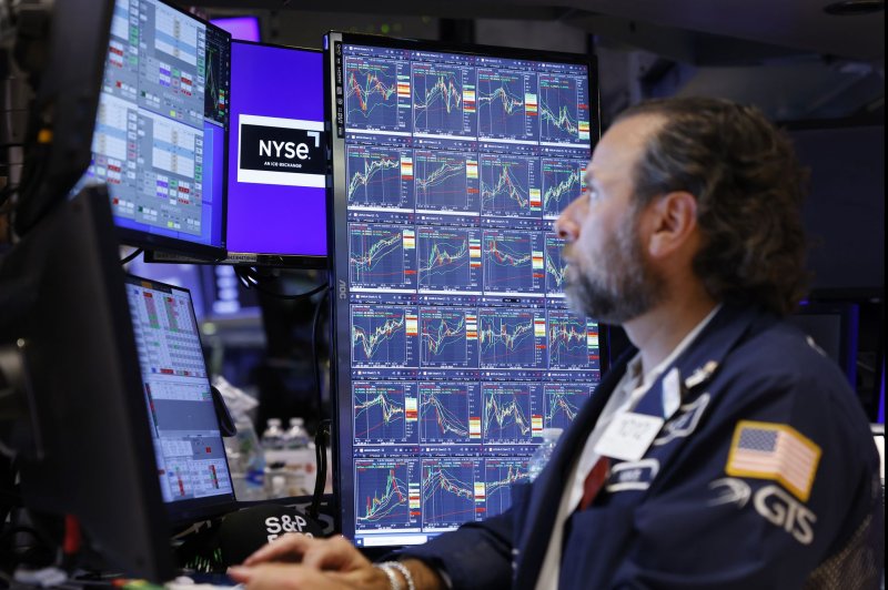 Traders work on the floor of the New York Stock Exchange on Wall Street in New York City on July 29. All three indexes were down Friday after the Labor Department's jobs report. Photo by John Angelillo/UPI