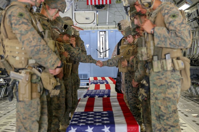 United States Marines honor the service members killed in action during operations during a Ramp Ceremony at Hamid Karzai International Airport in Kabul, Afghanistan on August 27, 2021. U.S. service members are assisting the Department of State with a Non-Combatant Evacuation operation (NEO) in Afghanistan. Photo by USMC/UPI