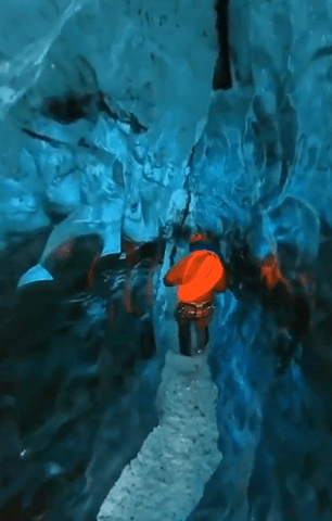 Footage showed one of the members of the search team entering the ice cave