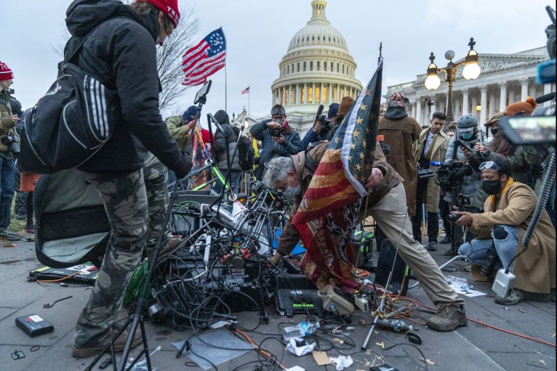 Pro-Trump rioters destroy network video gear as hundreds of others breach the security perimeter and penetrate the U.S. Capitol to protest against the Electoral College vote count that would certify President-elect Joe Biden as the winner in Washington, D.C., on Jan. 6, 2021. File Photo by Ken Cedeno/UPI