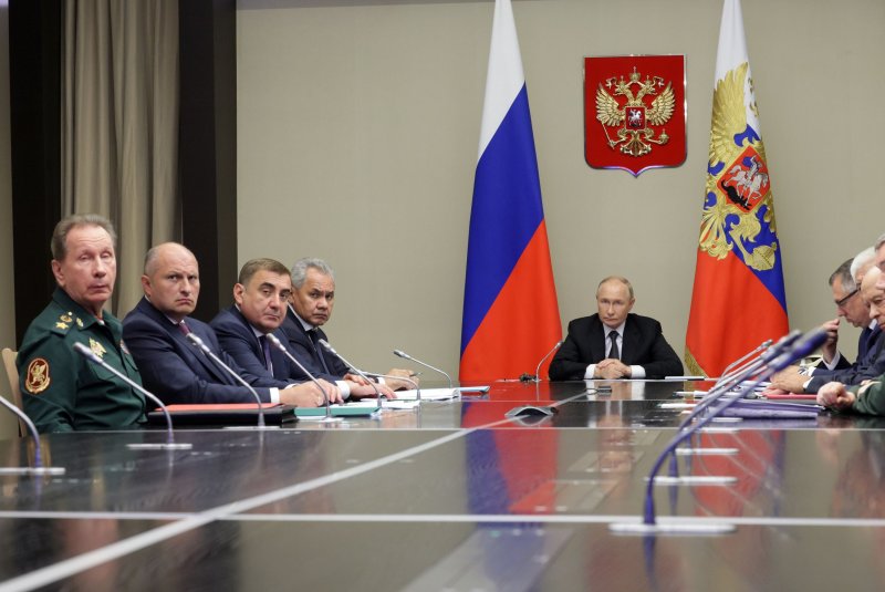 Russian President Vladimir Putin (C) holds a meeting with members of the Security Council, government, representatives of the Presidential Administration and governors of Belgorod, Kursk and Bryansk regions to discuss the response to an incursion by Ukrainian forces. Photo by Gavriil Grigorov/EPA-EFE