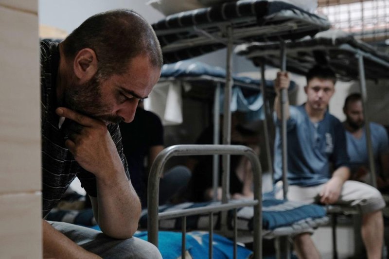 Russian soldiers captured by Ukrainian forces during the recent military incursion into the Kursk region wait inside their cells somewhere in Ukraine on Aug. 23. Photo by Maria Senovilla/EPA-EFE