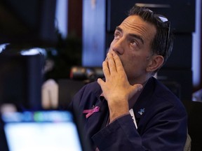 Trader Gregory Rowe works on the floor of the New York Stock Exchange, Monday, Aug. 5, 2024.