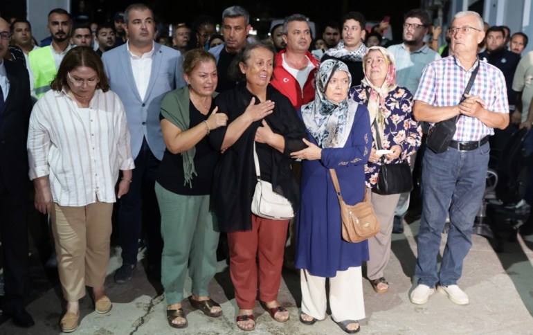 epa11602645 Relatives of Turkish-American activist Aysenur Ezgi Eygi, who was shot dead in the West Bank, watch Turkish police officers carry her coffin to Didim State Hospital's morgue, in Didim, near Aydin, Turkey, 13 September 2024. According to the Palestinian news agency WAFA, the 26-year-old activist Aysenur Ezgi Eygi succumbed to her wounds after being shot in the head by Israeli forces during a protest against settlement expansion in Beita, near Nablus, on 06 September. Following the procedures carried out by the Turkish Embassy in Tel Aviv and the Consulate General in Jerusalem, Eygi's body was brought from Tel Aviv to Baku and from there to Turkey. The funeral ceremony of Eygi is expected to be held in Didim, Aydin, on 14 September. EPA-EFE/ERDEM SAHIN