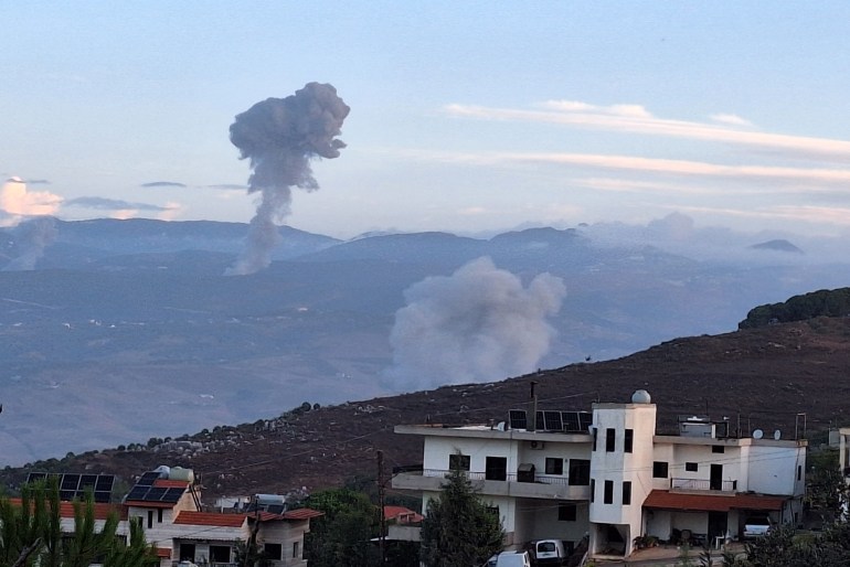 Smoke billows from the site of Israeli airstrikes