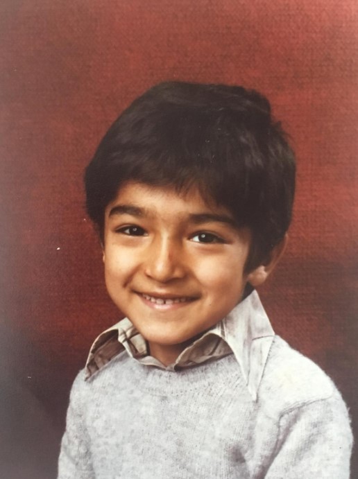 Adil Ray with his cheeky smile as a little boy