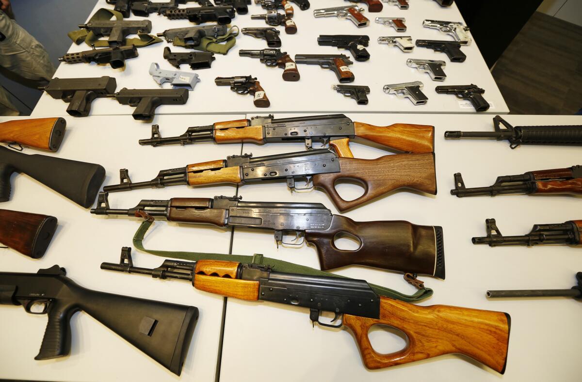 The Los Angeles Police Department displays weapons collected during a daylong gun buyback program in May. (Al Seib / Los Angeles Times)