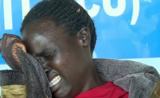 Rebecca Cheptegei's sister Evalyne Chelagat cries at a press conference this week