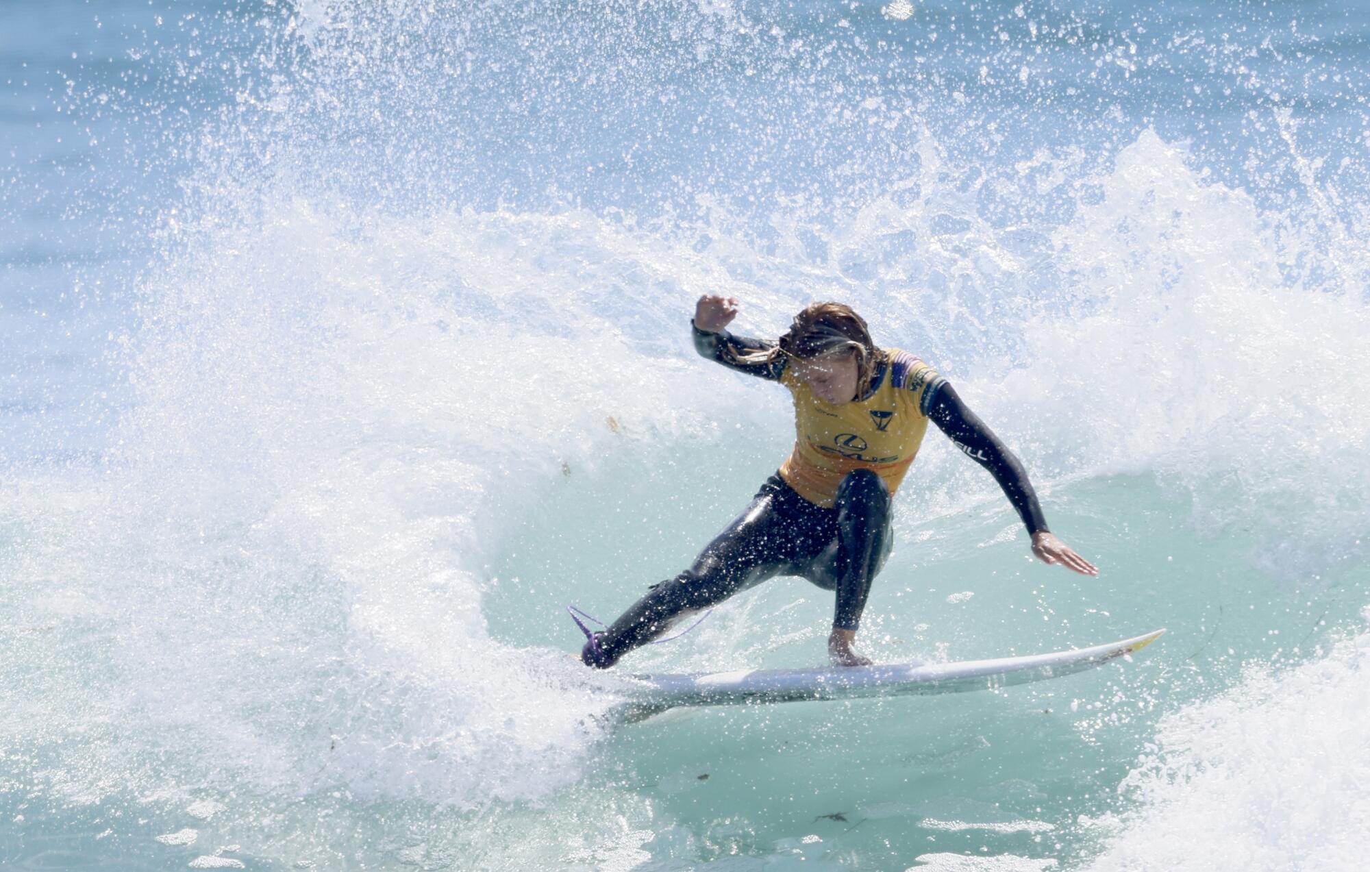 Oceanside's Caitlin Simmers cuts back on a wave during her finals match with fellow American Caroline Marks.