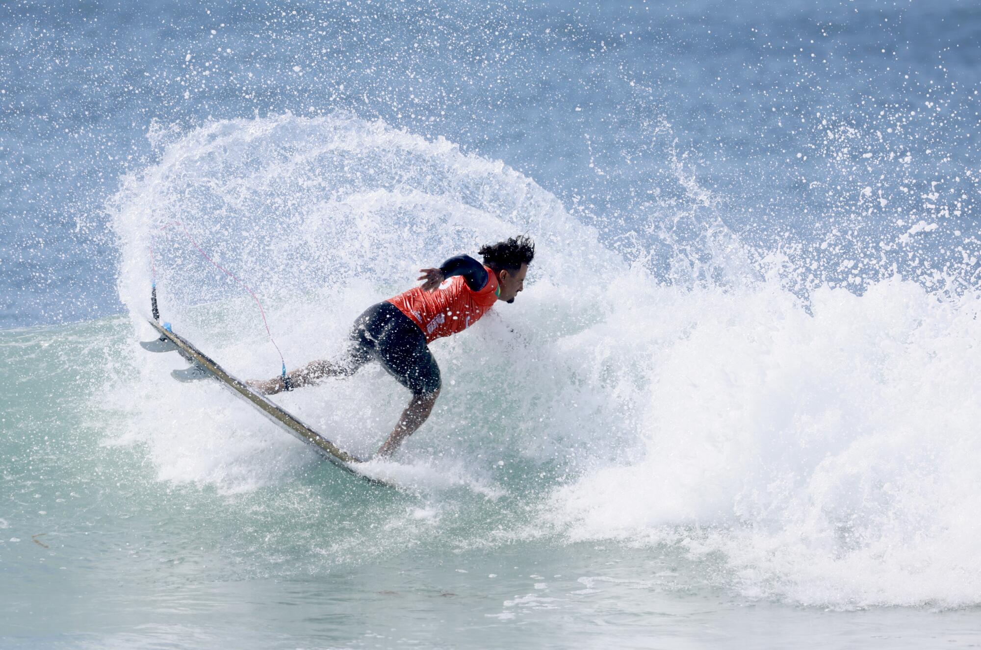 Brazilian Italo Ferreira pulls off a maneuver at Lower Trestles in San Clemente.