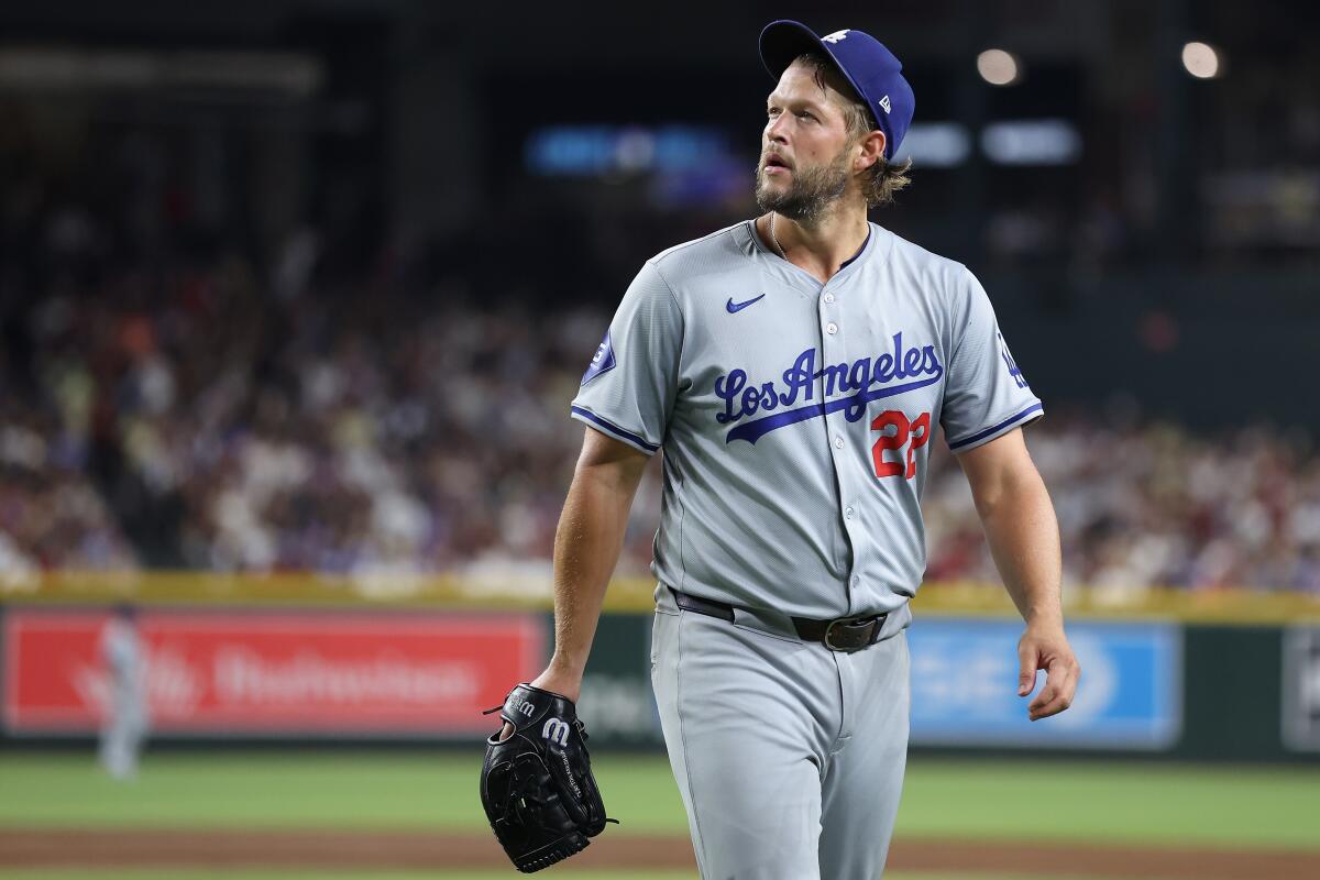 Dodgers pitcher Clayton Kershaw walks off the field after giving up a home run to the Arizona Diamondbacks.