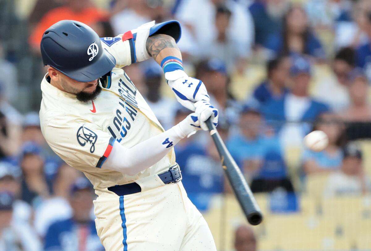 Andy Pages hits a two-run home run for the Dodgers against the Guardians the first inning Saturday.