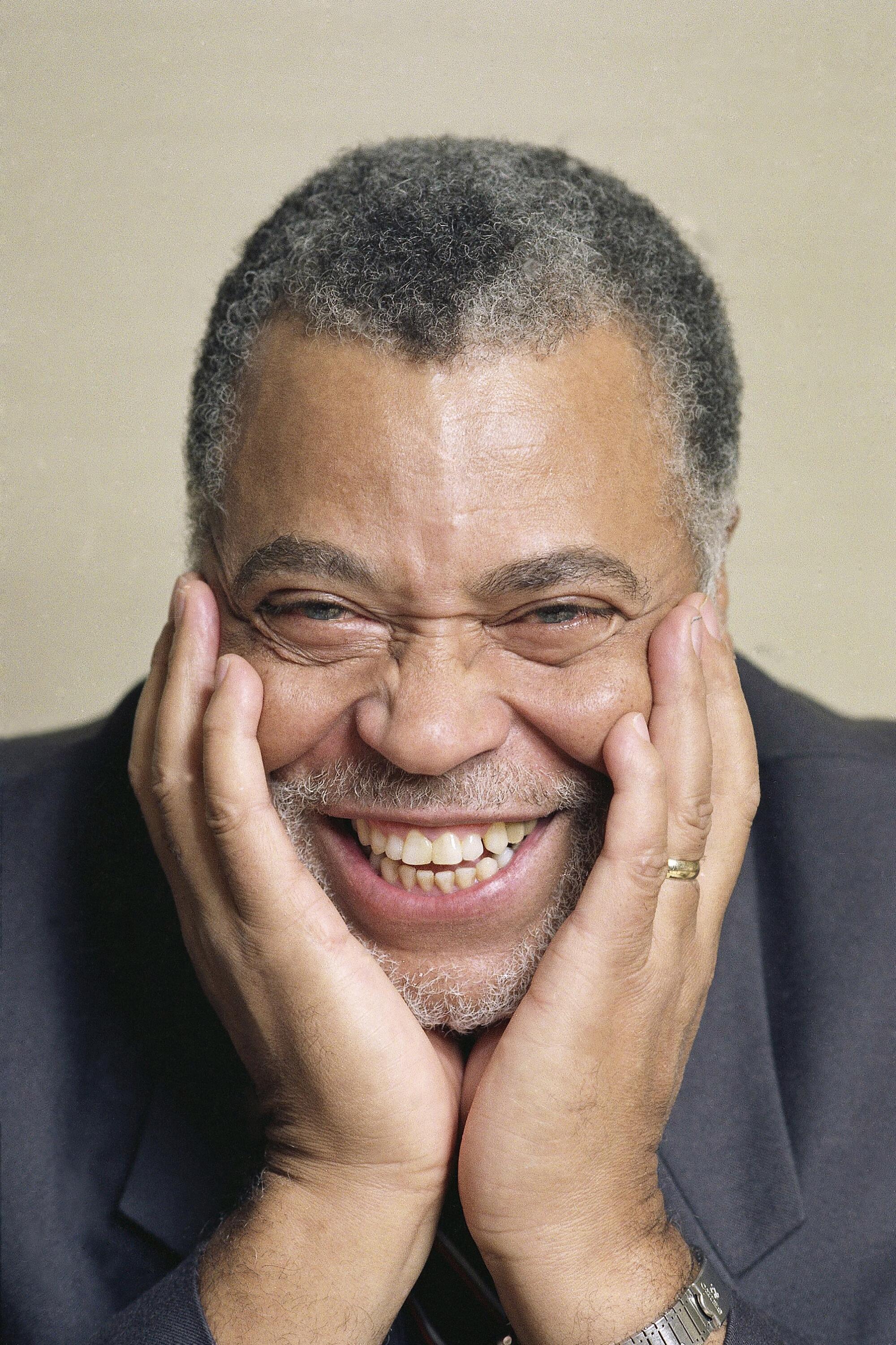 James Earl Jones smiles in a photo from 1990.