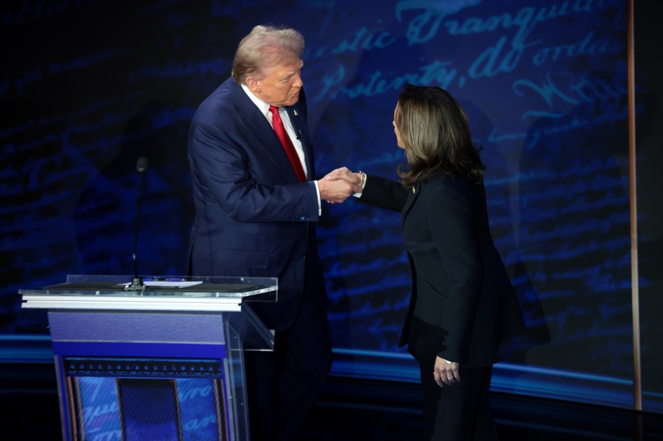 Donald Trump and Kamala Harris shake hands before the start of the debate