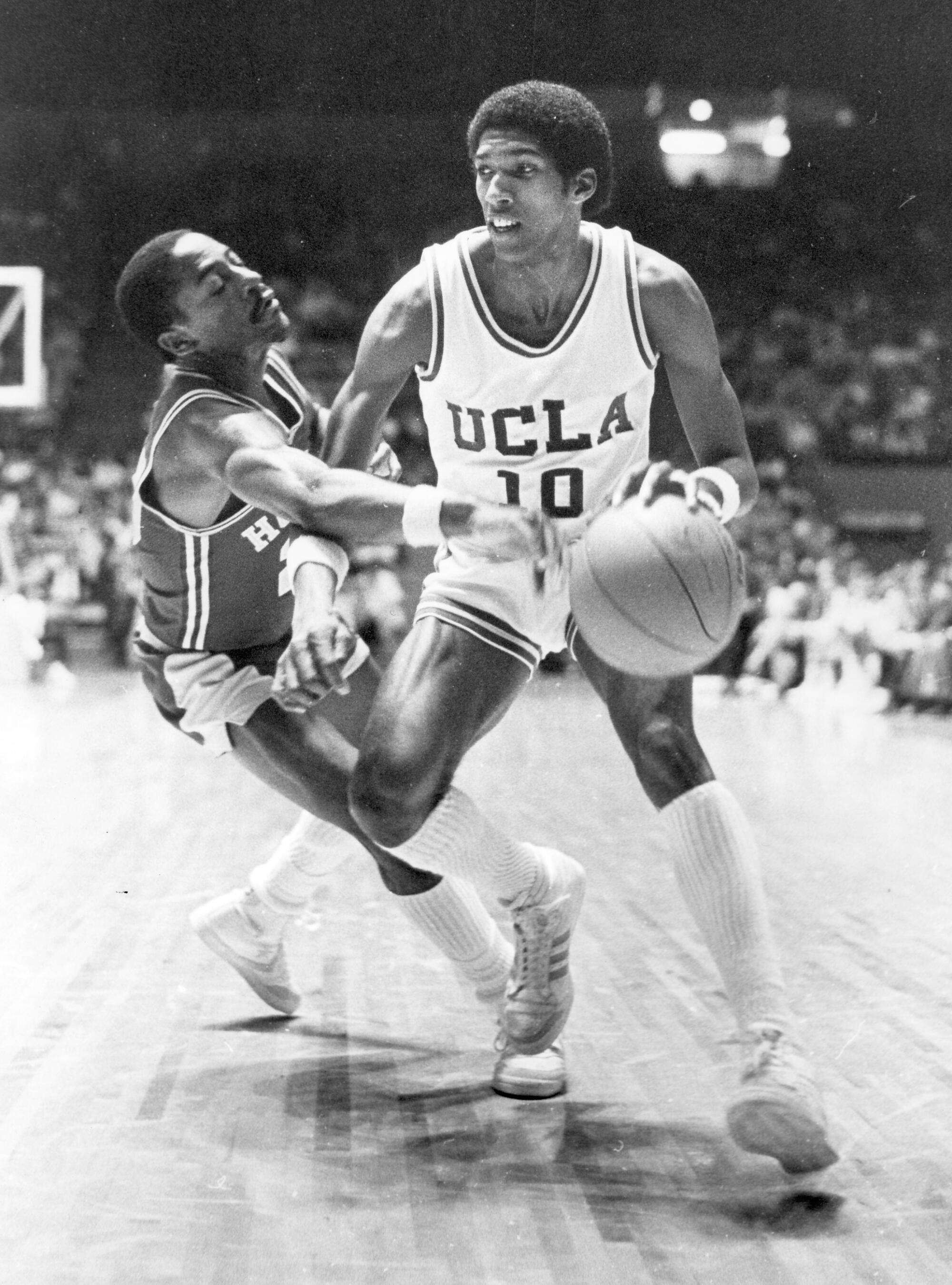 UCLA's Rod Foster, who played from the Bruins from 1980-83, dribbles past an opponent in this undated photo. 